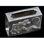 A Chinese 90 standard silver matchbox cover, decorated with a dragon chasing a pearl, stamped MH90