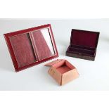 A small crocodile skin trinket box; together with a double red leather picture frame and a small