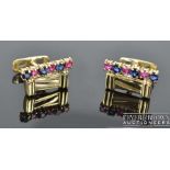 A pair of 9ct gold and ruby cufflinks, c1980, of gate design with six stone ruby and sapphire collet