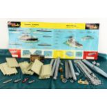 A cast metal AirFix harbour set, with plastic play mat with pieces, c1960s, unboxed