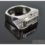 An attractive 18ct white gold and diamond dress ring, of rectangular shape, the top set with nine