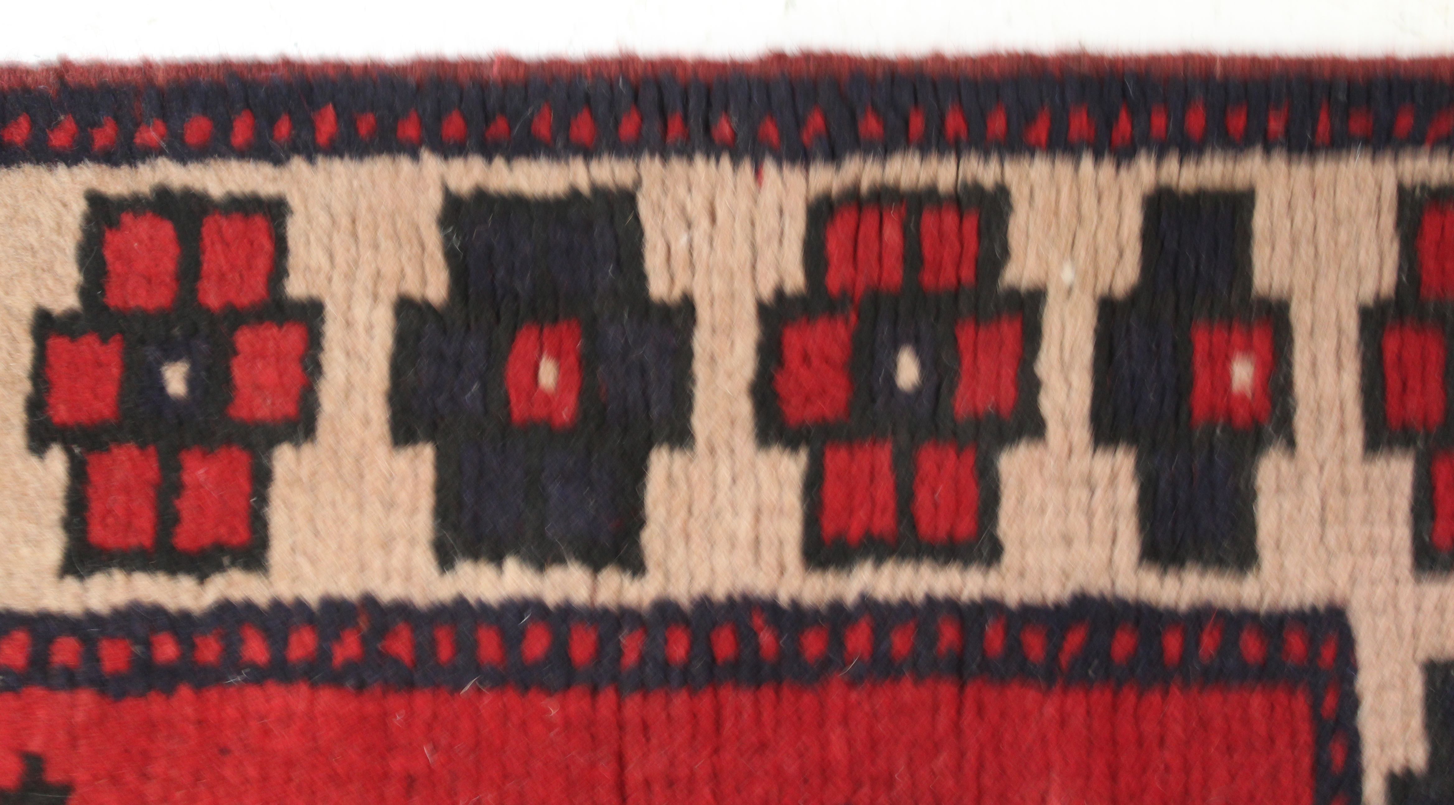 An Afghani wool runner, of thick pile, central banding of joined medallions on claret ground, the - Image 3 of 4