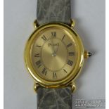 Piaget - A ladies 18ct yellow gold wrist watch, the oval shaped dial, matte gold with black roman