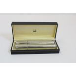A Dunhill pewter combined cigar case and hip flask, in original box, 18cm long