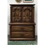 A modern oak cabinet, two drawers below two door cupboard, cupboard doors of heavy square relief