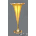 Richard Golding for Okra - An iridescent gold glass trumpet vase, swirled feather design with wavy