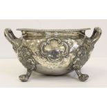 A silver plated oval footed jardinière or tureen, on four paw feet with high loop handles