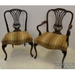 A good set of twelve late 19th Century Hepplewite design mahogany dining chairs, with carved and