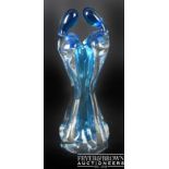 An Italian art glass sculptural vase, formed as a stylised pair of figures, bright blue and