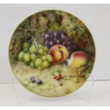 A Royal Worcester porcelain circular wall plaque, signed F.Roberts, painted with grapes, peaches and