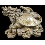 A Chinese Yuanbao coin gilded figural bronze, cast as a Bixi dragon turtle