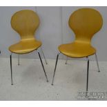 Two Arne Jacobsen modern style plywood 'Series 7' type chairs on chromed tubular frames (2)