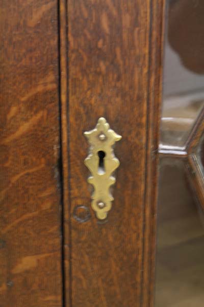 An early 20th Century oak hanging corner cupboard with astral glazed door opening onto 3 fixed - Image 2 of 4
