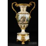 A Derby porcelain two handled urn on stand, the ovoid body probably decorated by Daniel Lucas with a