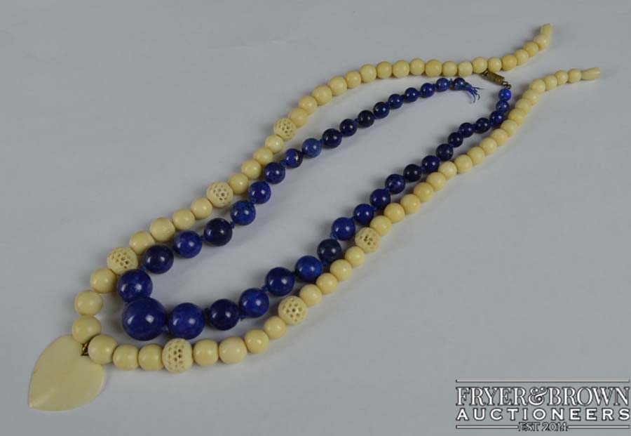 A graduated row of 38 Lapis Lazuli beads, c1920, and a 1920's bone or marine ivory bead necklace (