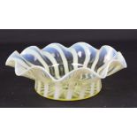 A straw opal glass bowl, probably Powell, of cardinal hat form with wavy rim, 20cm diam