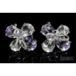 Kiki McDonough - a pair of diamond and pale amethyst 18ct white gold mounted quatrefoil ear clips,