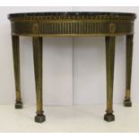 An attractive green and gilt gesso painted demi-lune table, deep line gadrooned apron over fluted