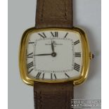 Baume & Mercier - An 18ct yellow gold gentleman's wrist watch, the cushion shaped white enamel