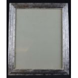 A large silver plated rectangular photograph frame, the copper stepped bevelled frame cast with