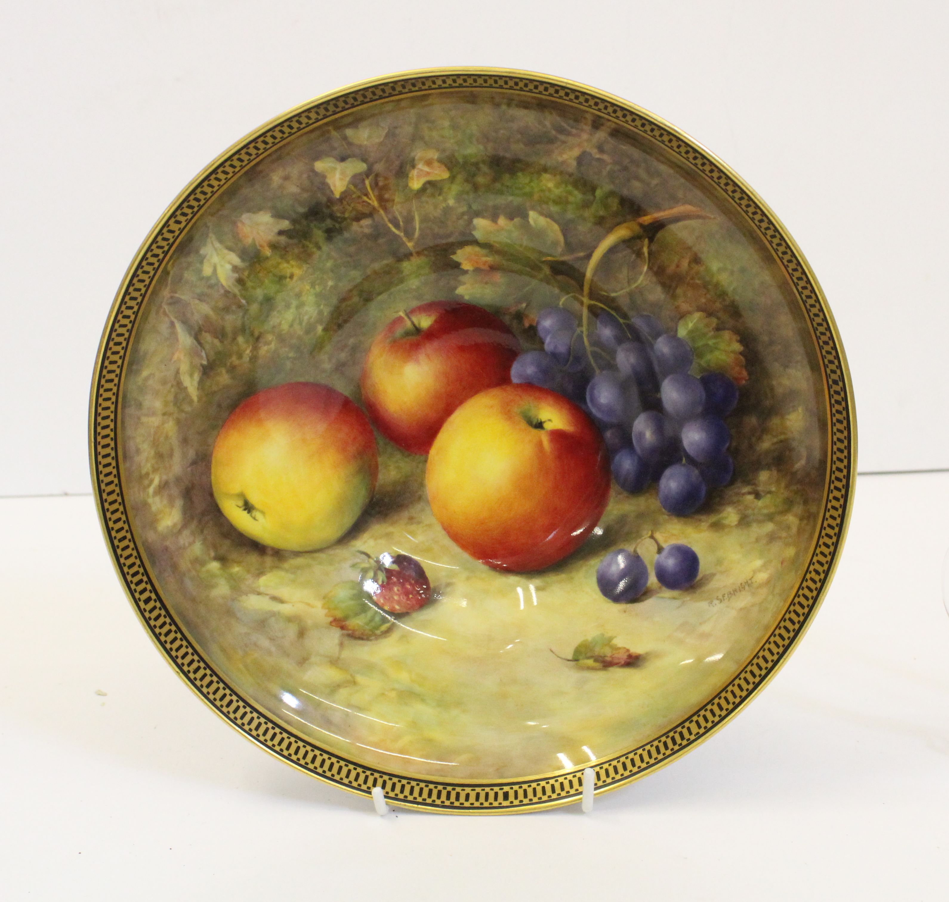 A Royal Worcester porcelain pedestal bowl, signed R.Sebright, painted with apples and grapes against - Image 2 of 3