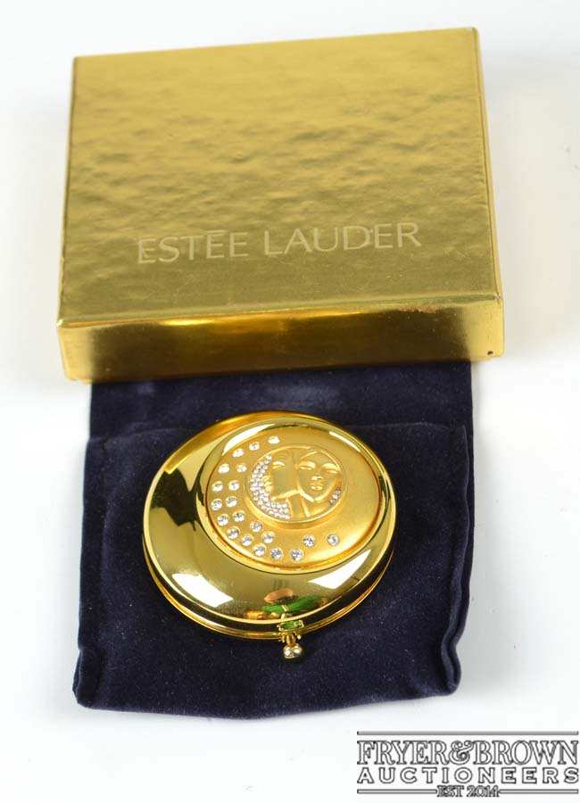 Estee Lauder - Collectable compact, Gemini, decorated with a reserve of two female heads on a moon b