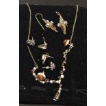 A silver garnet, pearl and diamond set necklace; a pair of Venetian style earrings stamped 925;