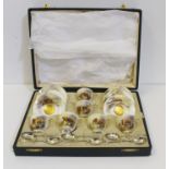 A Royal Worcester porcelain cased coffee set for six places, signed H.Stinton, painted with highland