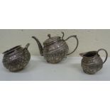 An antique Indian silver three piece tea set, Kutch region, c1870, comprising teapot, sugar bowl