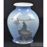 A Royal Copenhagen porcelain vase, of flattened baluster form, painted with a view of The Little