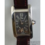 A ladies 18ct white gold Cartier US Tank wrist watch, with grey guilloche dial, sapphire winder,