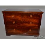 A Victorian flame mahogany small chest of drawers, c1860, the low chest with bevelled edge, mahogany