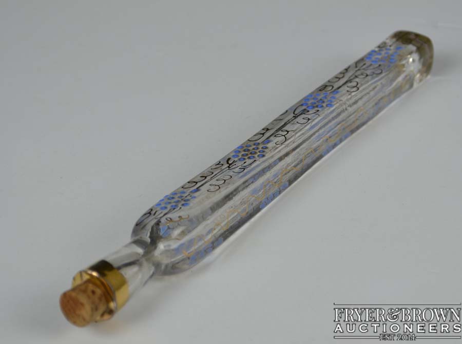 A 19thC enamelled glass lachrymatory tear catcher flask, enamelled in blue with gilding with a