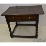 A late 17thC and later oak side table on bobbin turned legs and stretcher, the top composed of three