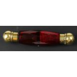 An unusual late 19thC ruby coloured faceted glass and gold and silver gilt double ended scent