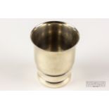 A small Henin & Cie French white metal child's beaker, of banded and tapered cylindrical form with