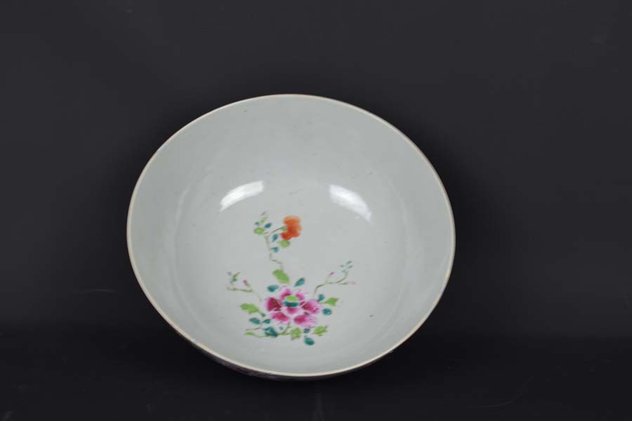 A Chinese export porcelain bowl, painted in famille rose enamels, with cranes amid a fenced - Image 3 of 4