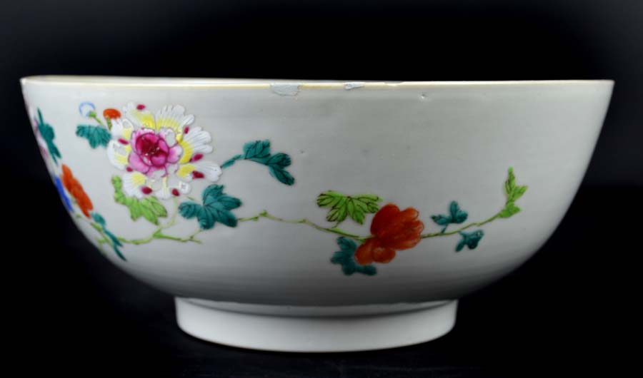 A Chinese export porcelain bowl, painted in famille rose enamels, with cranes amid a fenced - Image 2 of 4