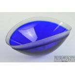 Neil Wilkin - A cobalt blue case elliptical glass bowl, the rim and base cut back to colourless