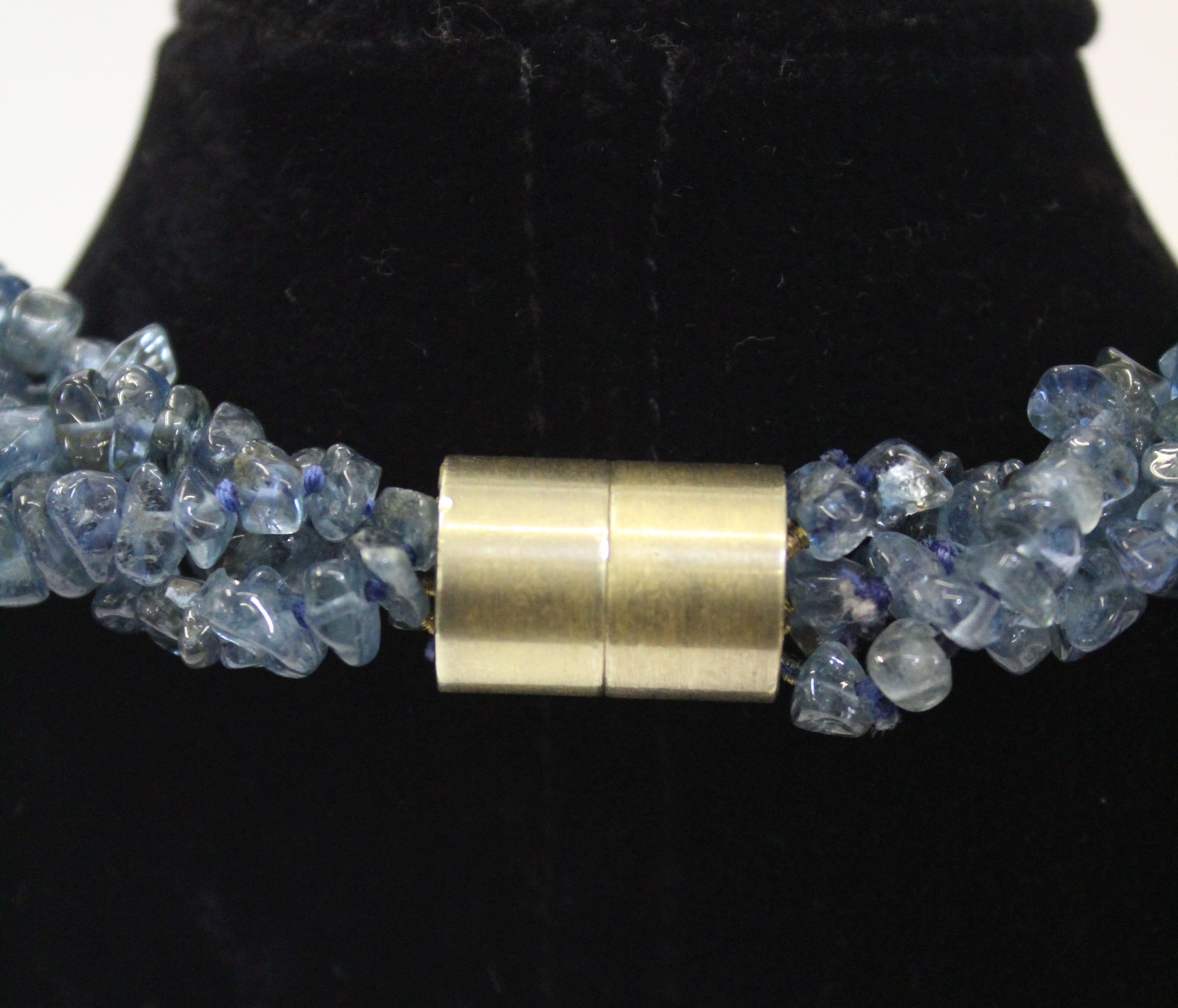 An unusual aquamarine, blue topaz and gold roundell necklace, the four rows of graduated natural - Image 4 of 4