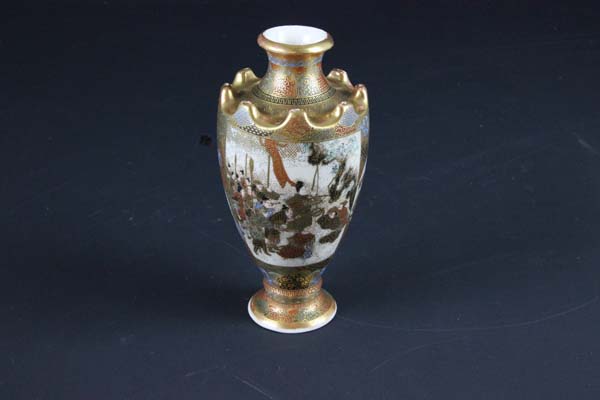 An unusual Japanese Satsuma vase c1900, heavily gilded and decorated with panels of typical