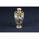 An unusual Japanese Satsuma vase c1900, heavily gilded and decorated with panels of typical