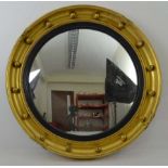 A Regency style gilded carved wood and gesso framed bullseye mirror, 47cm diam