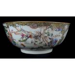 An exceptionally large Chinese export porcelain punch bowl, finely painted with figures in garden