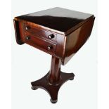 A Victorian mahogany drop leaf work table, with two drawers and two dummy drawers beneath the well