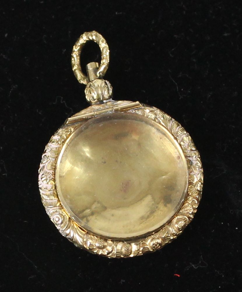 A small 15ct yellow gold locket, c1840, of circular form with carved floral borders - Image 2 of 7