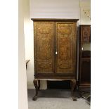 A fine and large Chinese export lacquer cabinet on stand, c1800, the cabinet with two doors