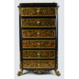 A miniature chest of drawers in boulework style, with gilt metal mounts, six drawers beneath a