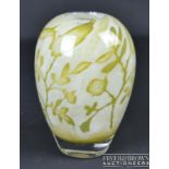 A Kosta Boda glass vase, of floating flowers pattern, ovoid internally decorated with green flower