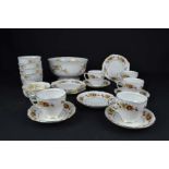 A Crown Staffordshire Aristocrat fruit service, white gilded with floral sprays comprises
